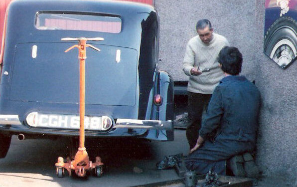 Technicians working on a vintage Bentley in the Riddell's workshop