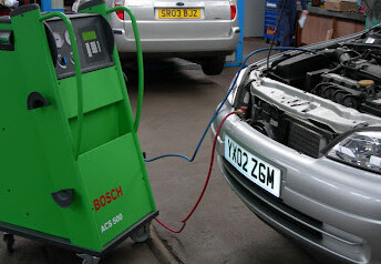 Bosch air conditioning service rig connected to a car