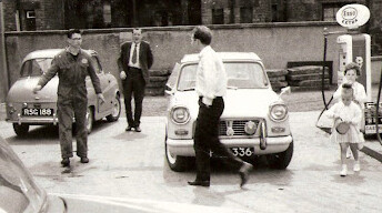 Black and white photograph of the Riddell's Garage forecourt in earlier years